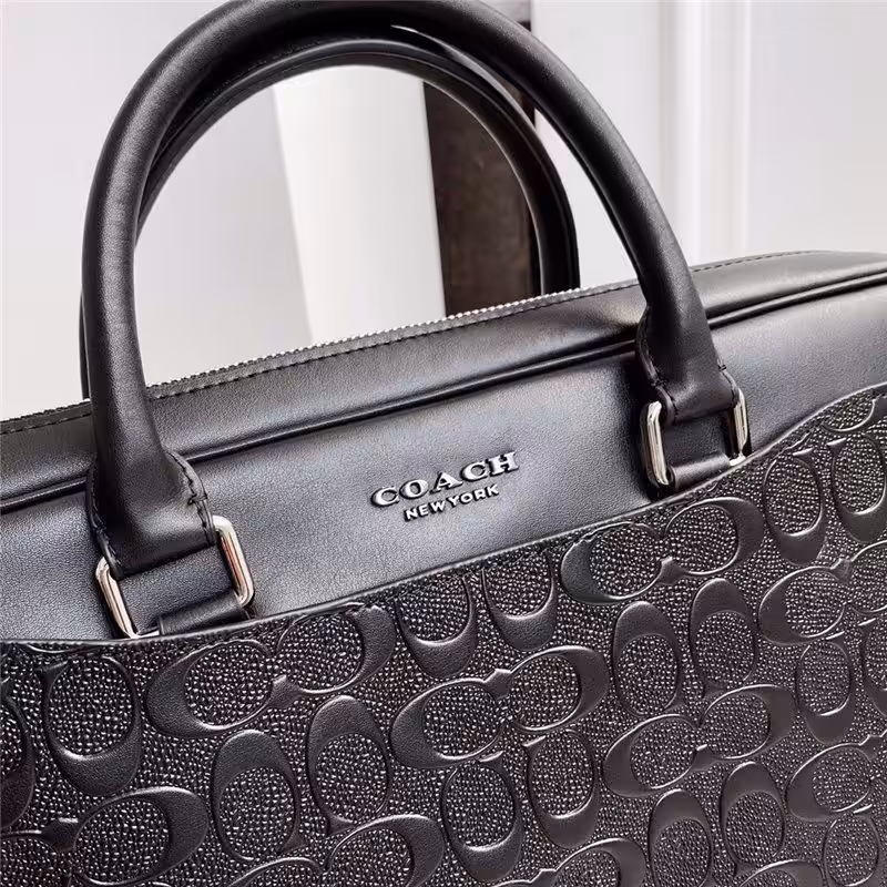 WhatsApp Image 2025-12-18 at 10.25.52 PM (1) Coach Embossed Premium Laptop Bag