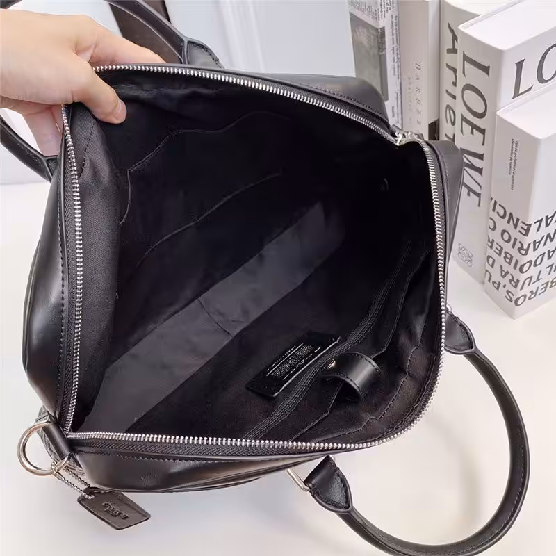 WhatsApp Image 2025-12-18 at 10.25.53 PM (1) Coach Embossed Premium Laptop Bag