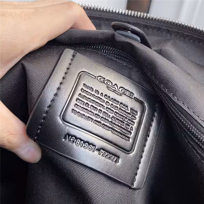 WhatsApp Image 2025-12-18 at 10.25.53 PM (2) Coach Embossed Premium Laptop Bag
