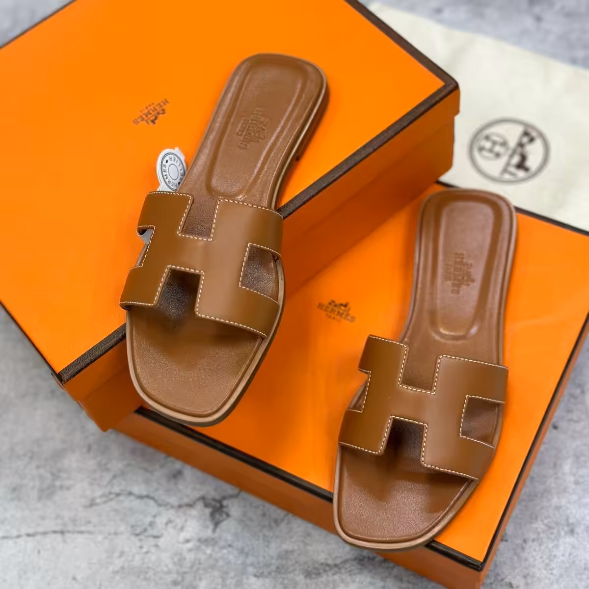 WhatsApp Image 2026-01-05 at 11.03.17 PM Hermes Oran Brown Flat Sandal